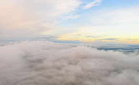 Aerial view clouds over the forest and lake . View from drone. Aerial top view cloudscape. Texture...