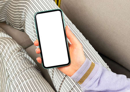 Smartphone mockup in woman hand. New modern black frameless smartphone mock up with blank white...