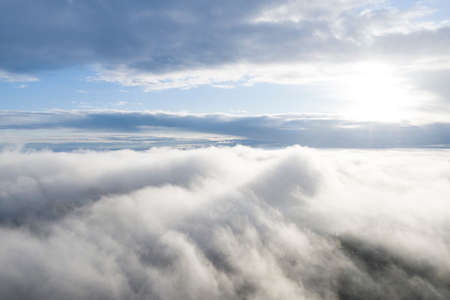 Aerial view white clouds in blue sky. View from drone. Aerial view cloudscape texture background....