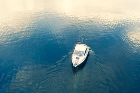 Aerial view fisherman on boat at the ocean. Top view beautiful seascape with the fishing boat....