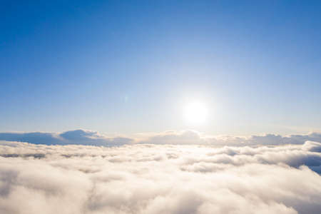 Aerial view white clouds in blue sky. Aerial top view cloudscape. Texture of clouds. View from above. Clouds texture bacground. Panorama clouds textureの写真素材