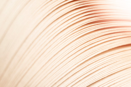 Macro shot of open book. Education and study concept. Close-up of opened book pages. Macro view of book pages. Edges of open paper book sheets close-upの写真素材