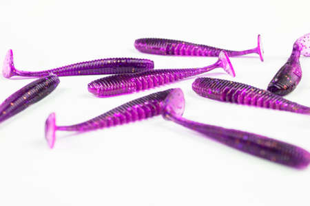 Jig silicone fishing lures isolated on a white background. Silicone fishing baits isolated. Colorful...