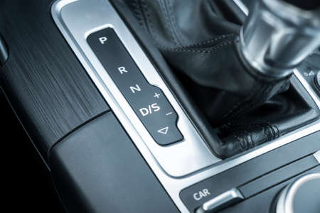 Automatic gear stick of a modern car. Modern car interior details. Close up view. Car inside....