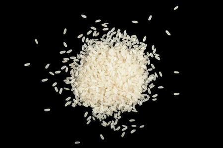White rice isolated on black background . Heap of white rice isolated on black background. Rice textureの写真素材