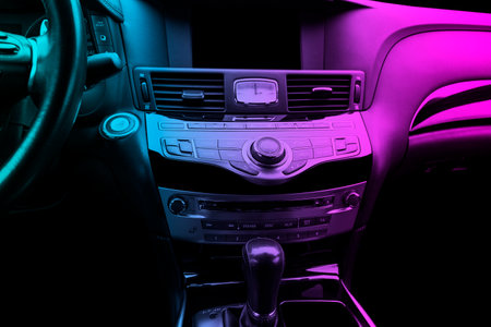 Luxury car inside. Interior of prestige modern car. Comfortable leather seats. Black perforated...