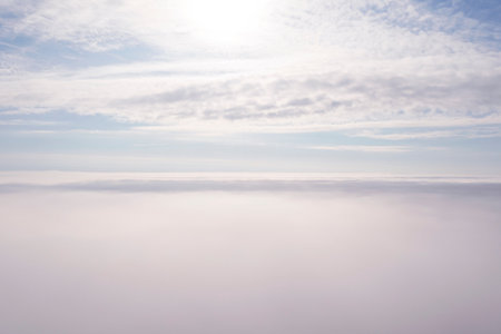 Aerial view white clouds in blue sky. Aerial top view cloudscape. Texture of clouds. View from...