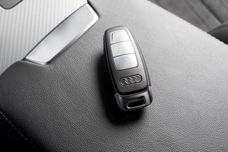 Sankt-Petersburg, Russia, March 25, 2021: Close up of Audi A6 car keys in black leather interior of...