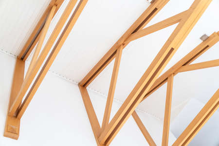 Wooden design interior. Wooden beams ceiling .Design element. Modern house interior. Construction of...