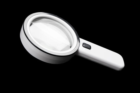 Magnifying glass isolated on black background. Magnifying glass for detailed imageの写真素材