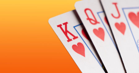 Playing cards isolated on color background. Hand of playing clubs cards isolated.