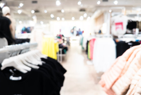 Abstract blurred background of modern department store hall or shopping center mall. Blurred lights background. Blurred defocused bokeh lights with modern interior architectureの写真素材