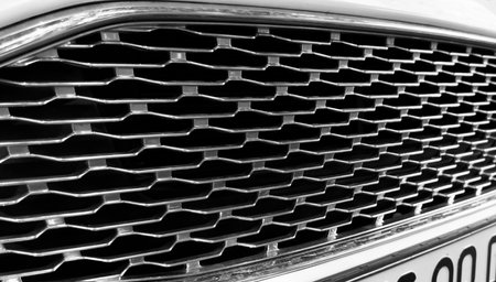Radiator grille pattern. Car radiator grill close up. Chrome grill of big powerful car engine.の写真素材
