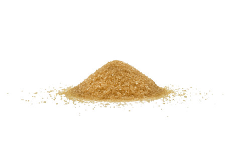 Brown sugar powder isolated on white background. Macro shot brown sugar texture isolatedの写真素材