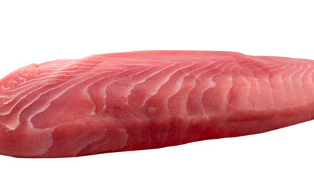 Yellow fin tuna steak isolated on white background. Fresh rare tuna steak isolated on white. Raw yellowfin tuna fillet texture. Background fresh tuna meat. Top view of slices of fish meat.の写真素材