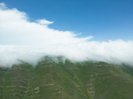 Aerial view mountain. Scenic aerial view mountain ridge. Above green landscape with sunlight...