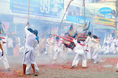 Unidentified people of parade on vegetarian festival in Trang, Thailand  The Vegetarian Festival is an annual festival held during the ninth lunar month of the Chinese calendar  TRANG, THAILAND - OCT 12のeditorial素材