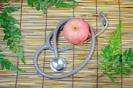 Red apple and  Stethoscopeの写真素材
