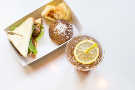 Iced tea and lemon with sandwichesの写真素材