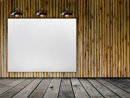 Blank frame on wood wall with Ceiling lampの写真素材