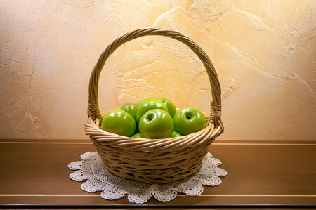 Green apples in basket, selective focusの写真素材