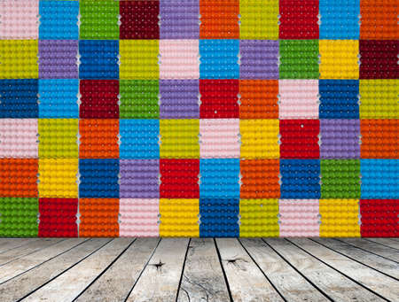 Colorful paper egg tray with wood floor, Colorful background
