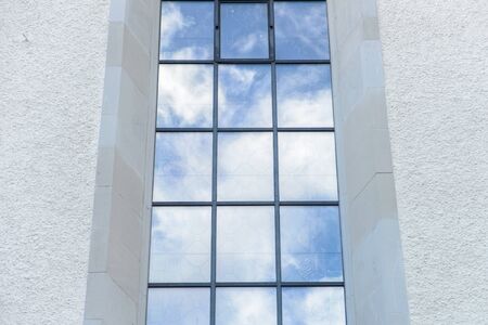 Clouds reflected in classic windowsの写真素材