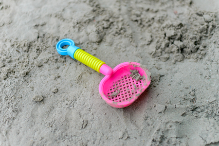 Colorful beach toys  on sandの写真素材