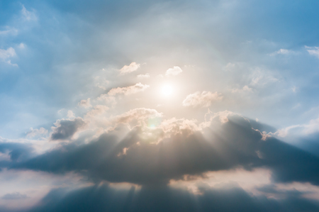 Rays of light shining through clouds, sunsetの写真素材