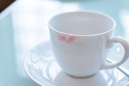 lipstick stain from a woman on ceramic coffee cupの写真素材