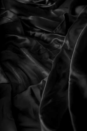 abstract background crumpled or wavy folds of fabric texture, pattern elegant wallpaper designの写真素材