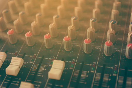 Sound mixer control panel, close-up of audio controlsの写真素材
