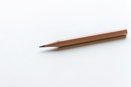 Wooden Pencils on white paper with copy spaceの写真素材
