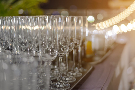Empty champagne glasses ready for party - drink, vacation and celebration concept