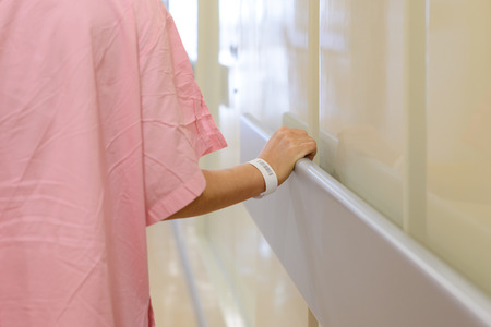 women patient hand holding to handrail in hospital, support, help conceptの写真素材