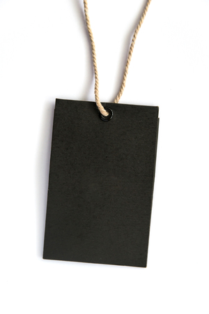 Blank black label (tag) tied with stringon white background. Price tag, gift tag, sale tag, address labelの写真素材
