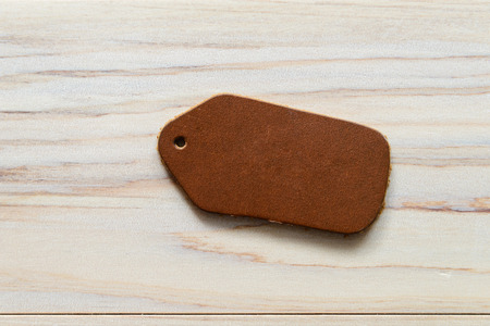 Blank label (tag) on wooded background. Price tag, gift tag, sale tag, address labelの写真素材