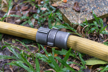 pipe connection of fire hose on the groundの写真素材