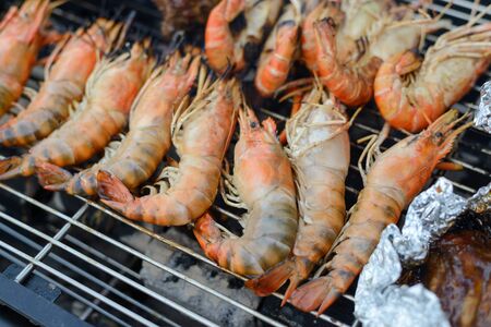 shrimps grilled on the charcoal stove, bbq seafoodの写真素材