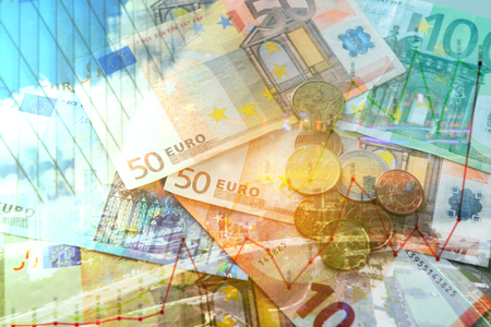 Double exposure of city, graph, banknote and coins money for finance and business conceptの写真素材