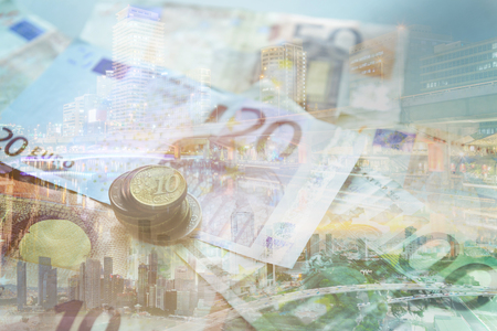 Double exposure of city, banknote and coins money for finance and business conceptの写真素材