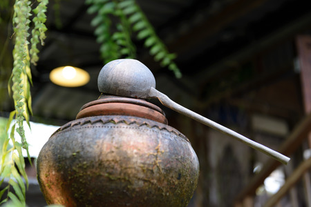 Water dipper made from coconut shell on Water Clay potsの写真素材