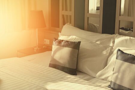 Pillows on bed decoration in modern bedroom interiorの写真素材