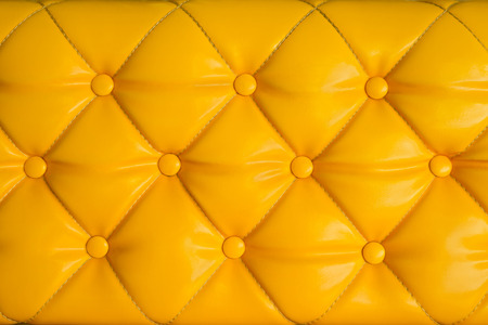 Close up yellow retro chesterfield style, capitone textile backgroundの写真素材