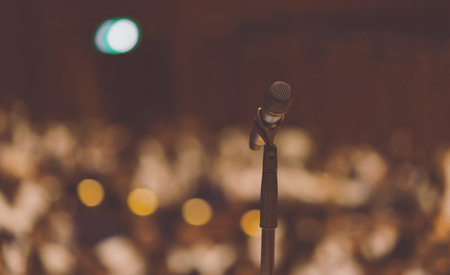 Microphone on the podium in seminar or conference hallの写真素材