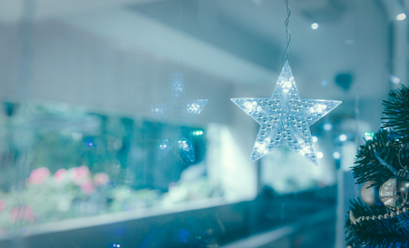 Lightning Stars hanging for decoration during the winter time for Christmas. Interior Design Decoration with copy spaceの写真素材