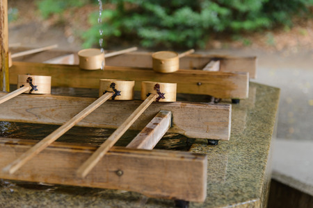 Dipping cups for cleansing ceremony, hand wash pavilion before enter the shrine gate at Meiji jingu in Tokyo, Japan. religion and cultureの写真素材