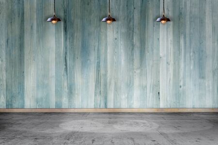 Empty room - wooden wall with lamp and laminate flooring. User for backgroundの写真素材