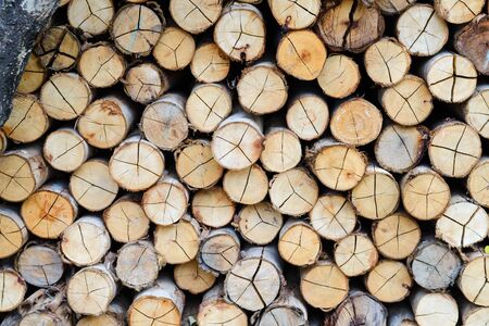 wall firewood - stacked of firewood prepare for the fireplace, barbecue, Background and texture