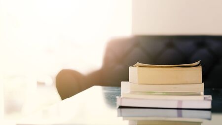 Stack of books on wooden table with copy space. Education background. Back to school conceptの写真素材